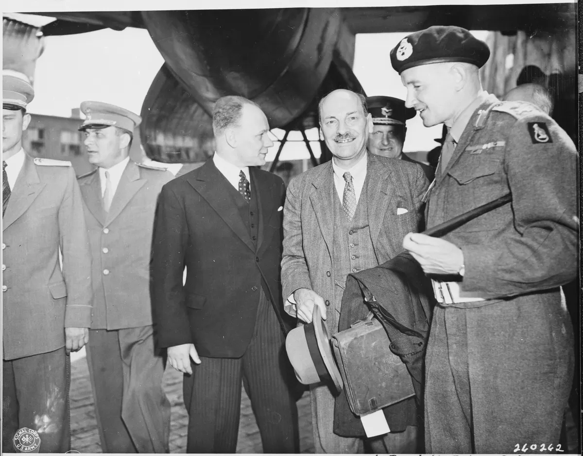 British candidate for Prime Minister Clement Attlee (fourth from left) arrives at Gatow Airport in Berlin, Germany to... - NARA - 198874