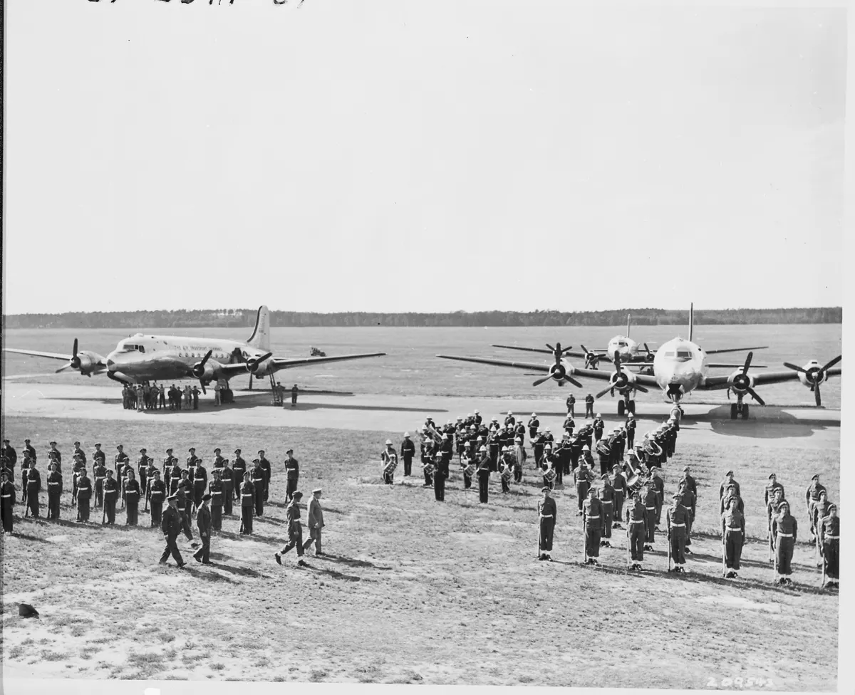 Distance view of British Prime Minister Winston Churchill inspecting the honor guard at Gatow Airport in Berlin... - NARA - 198830