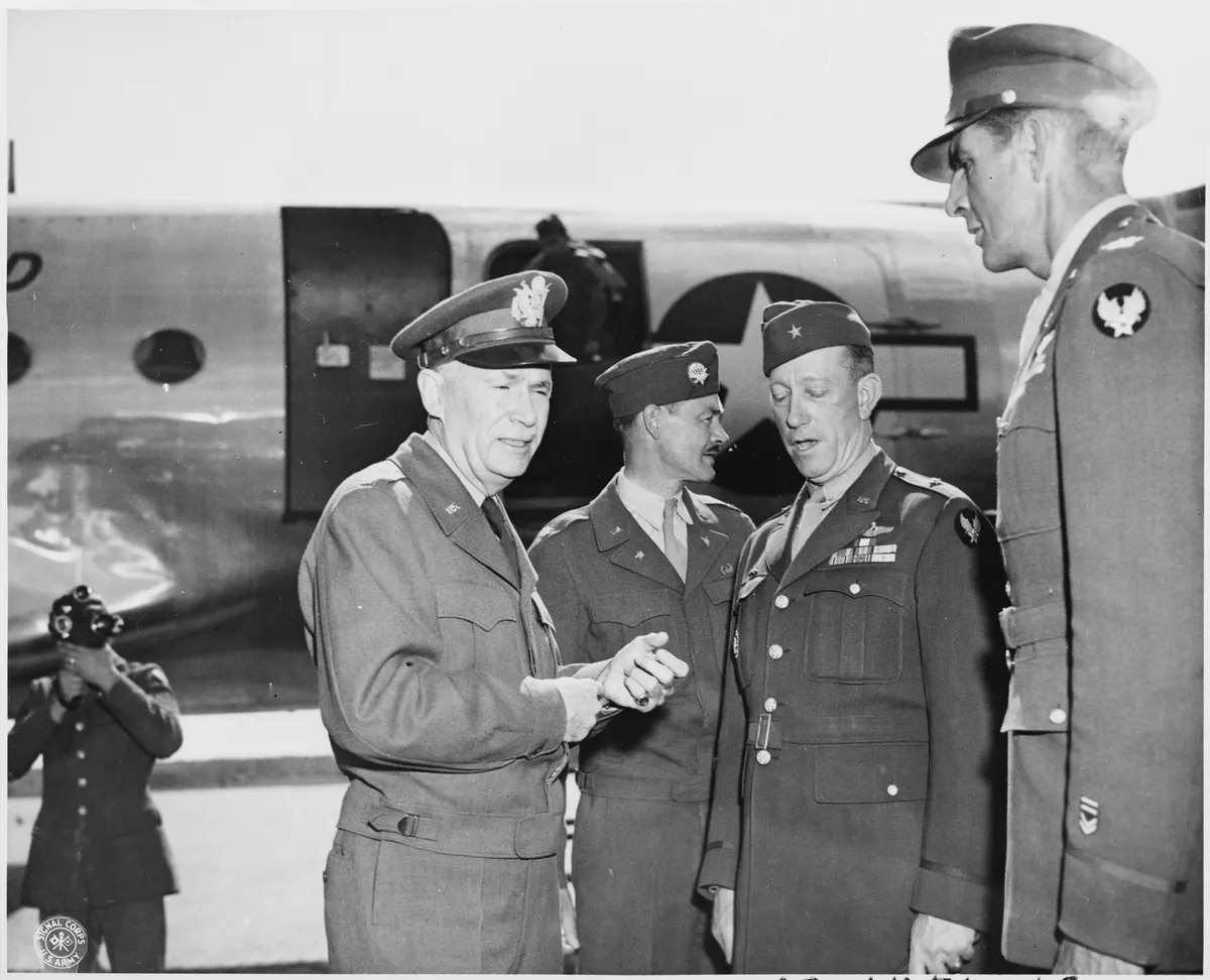 Lt. Gen. Brehon Somervall, left, is greeted by Brig. Gen. Earl Hoag, third from the left, Commanding General of the... - NARA - 198867
