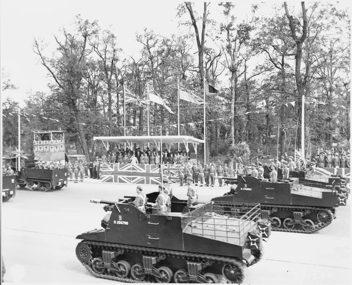 Reviewing stand watches a British armored column pass by during the British victory parade in Berlin, Germany during... - NARA - 198898