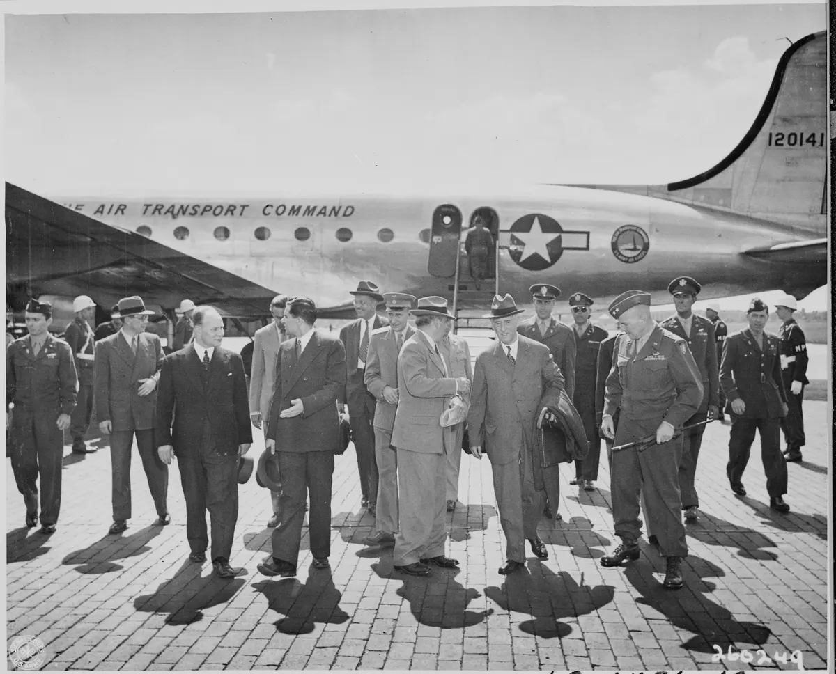 Secretary of War Henry Stimson (center) walks with Gen. Floyd L. Parks at Gatow Airport in Berlin, Germany where Mr.... - NARA - 198861
