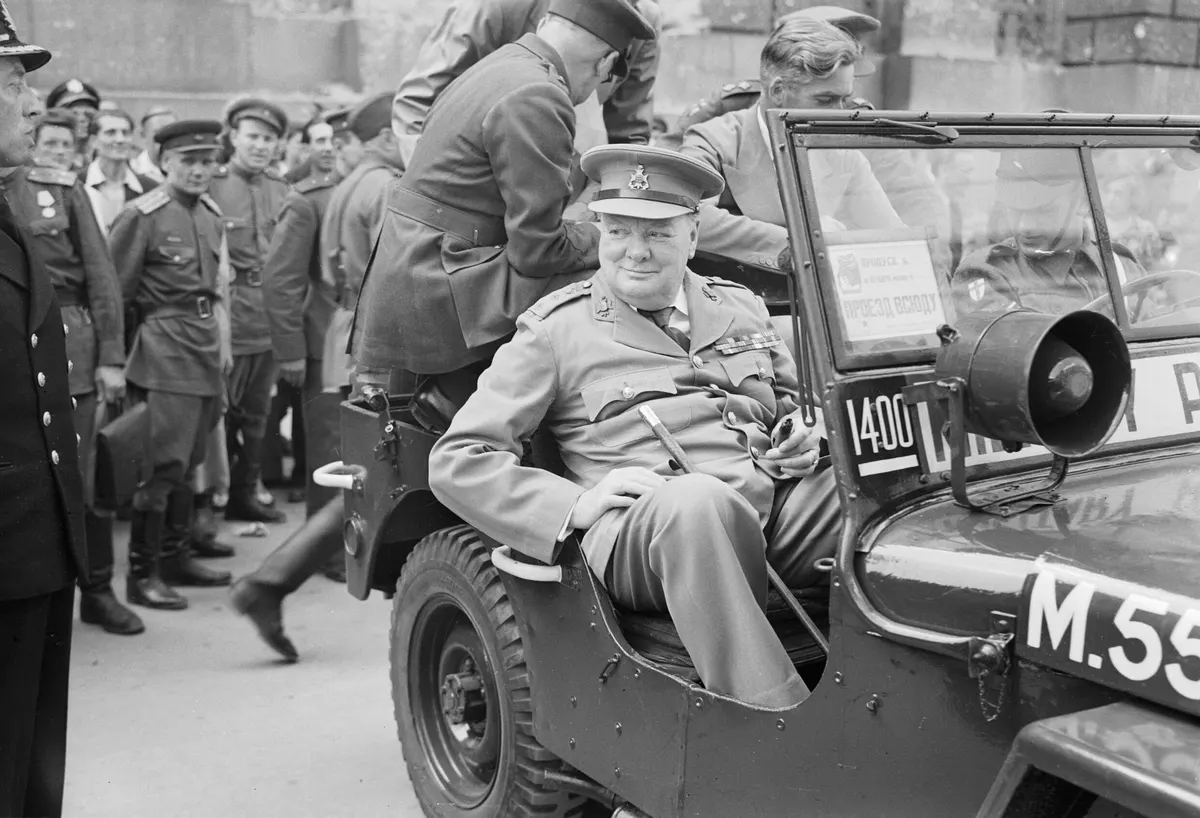 Winston Churchill in a jeep outside the German Reichstag during a tour of the ruined city of Berlin, 16 July 1945. BU8950