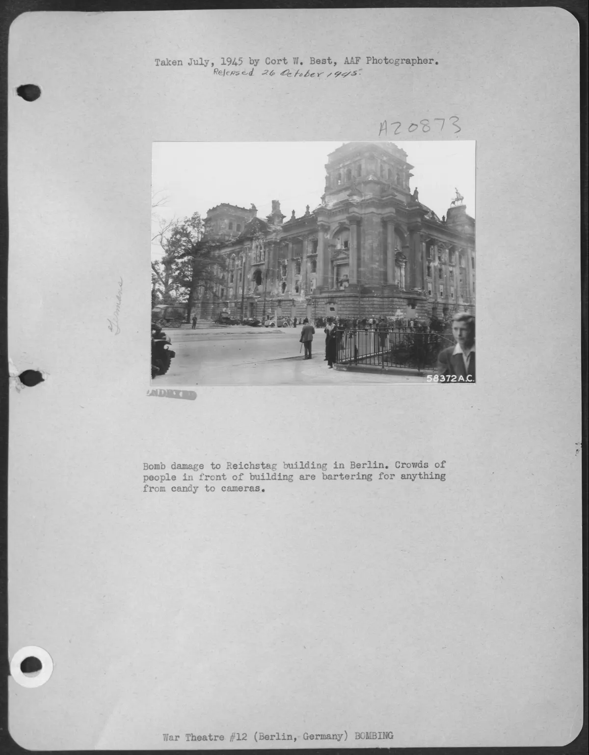 Bomb Damage To Reichstag Building In Berlin. Crowds Of People In Front Of Building Are Bartering For Anything From Candy To Cameras. (U.S. Air Force Number 58372AC)