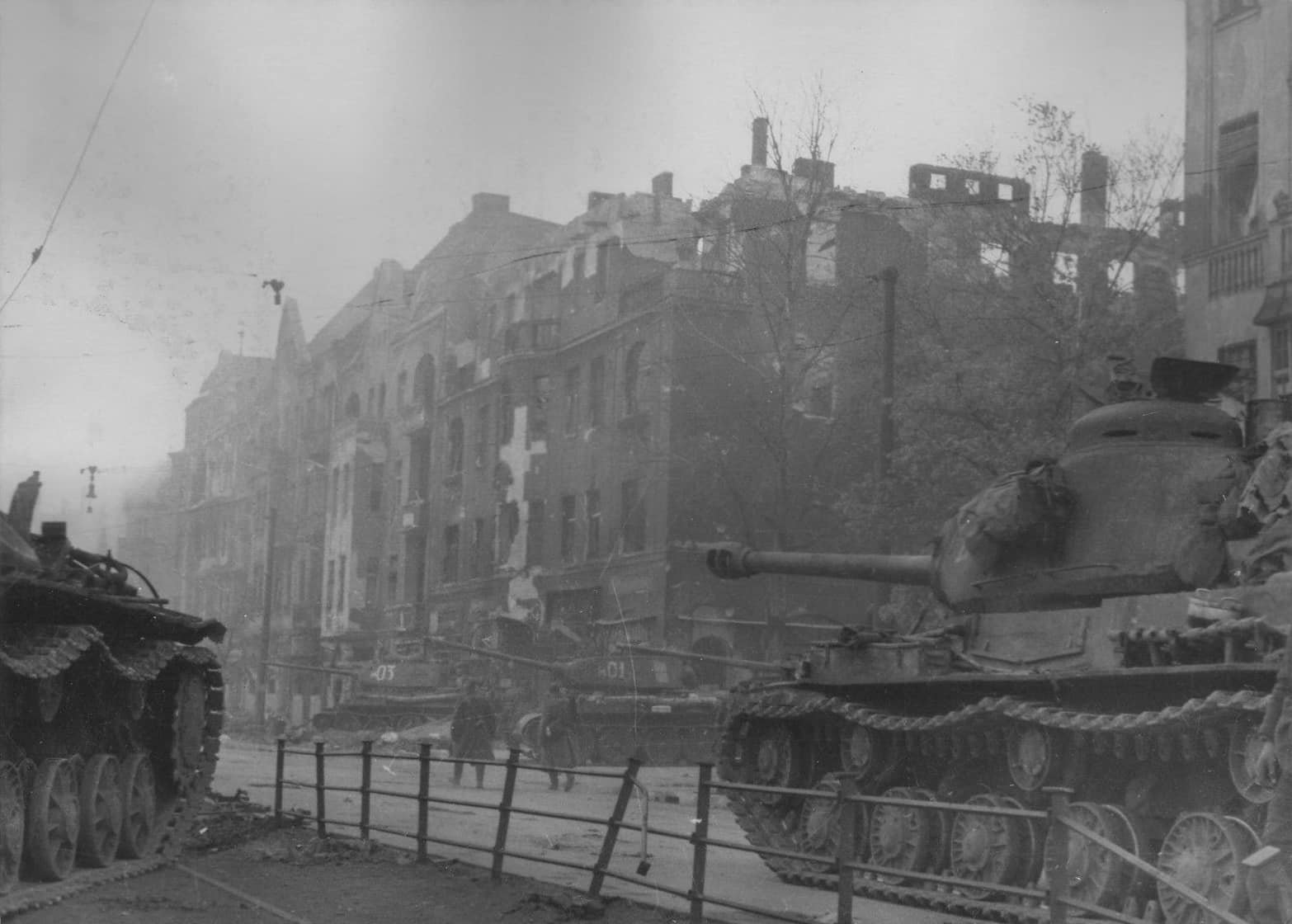A column of Soviet heavy IS-2 tanks on the streets of Berlin