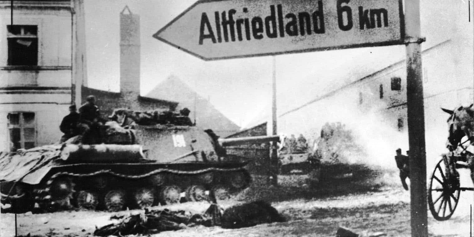 Soviet self-propelled gun ISU-122 moves along the street of the village in Brandenburg