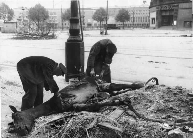 Armored personnel carrier Sd.Kfz.250 surrounded by the bodies of soldiers of the SS Nordland division after a failed escape on Friedrichstrasse