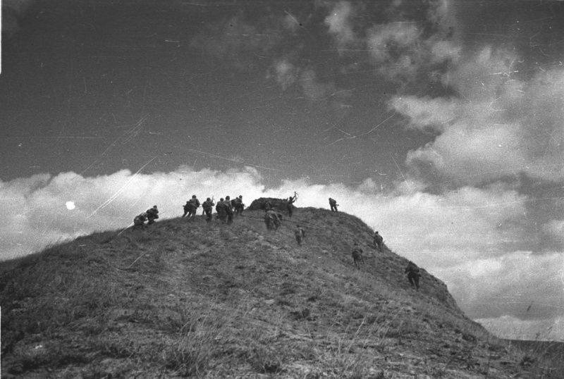 Soviet troops reenact an attack on German positions